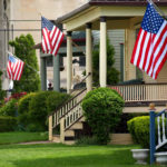 American flags flying from front porches